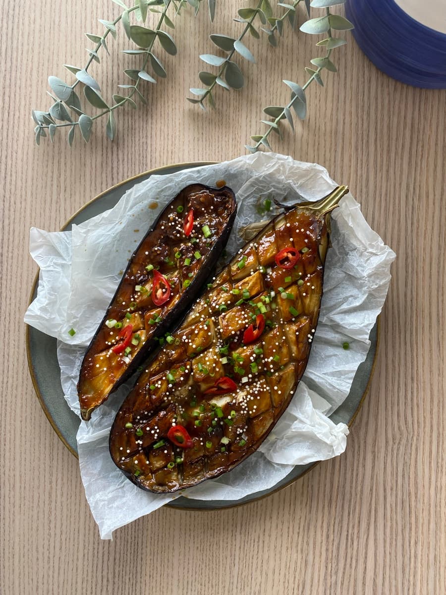 Roasted eggplant with sesame seeds, herbs and chilli